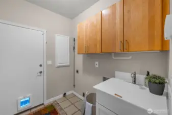 main floor laundry room as you come in from the 2 car garage