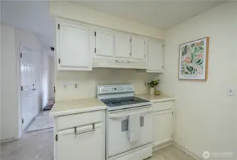 The kitchen is in great working order with numerous cabinets for storage.