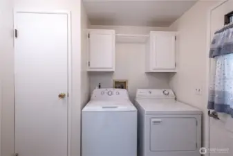 The side entrance is the mud room with washer and dryer (included).