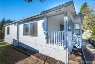 The covered porch is perfect for any weather.