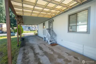 The oversized carport will keep you dry in all seasons.