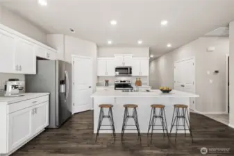 Virtually staged. Laminate flooring through main living spaces of the home. Photos are for representational purposes only. Colors and finishes may vary.