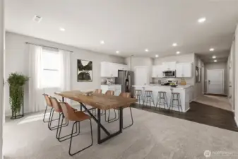 Virtually staged. Laminate flooring through main living spaces of the home. Photos are for representational purposes only. Colors and finishes may vary.