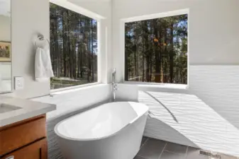 Enjoy a soak in the freestanding tub after a long day of outdoor fun.
