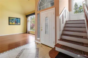 High vaulted ceilings, tile entry and cherry hardwoods welcome you into this spacious home.