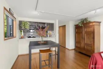 Kitchen open to dining area with a breakfast bar