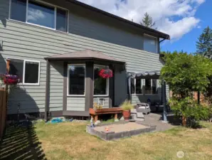 Fully fenced backyard with patio.
