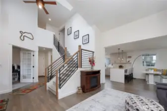 Open entry plan with high ceilings and skylights.