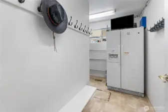 Front Hall Mudroom With Refrigerator, Pantry Storage, and Built in Surveillance System
