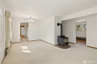 Main living area, looking through dining space and into kitchen.