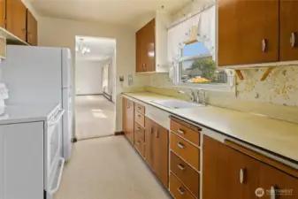 Galley style kitchen, appliances stay.