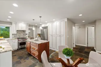 View of the breakfast nook with the doors to the main floor bath and mudroom beyond.
