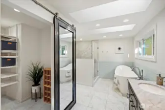 Step into the spa-like bathroom with a walk-in closet! So many features to mention in this 2019 studs-out bathroom remodel including all new plumbing, dual skylights, Carrara marble floors with radiant heat, oversized marble shower, Victoria + Albert volcanic limestone Amalfi slipper tub, Brizo faucets, electric hookup for smart toilet/washlet, dual vanity with Carrara marble counters and so much more!