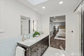 Another view of the custom vanity with interior electrical outlets, Robern medicine cabinets/mirrors with storage and a Hubbardton forge lighting sconce.