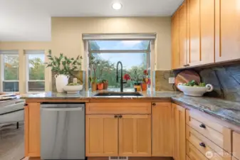 Enjoy backyard views while preparing meals in your sunlit kitchen.