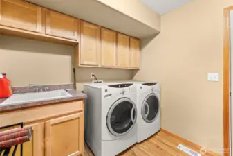 Mudroom and laundry room offering functionality.