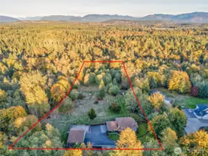 Beautifully maintained acreage surrounded by mature landscaping.