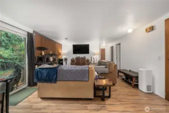 Unit 1 Central gathering area with entertainment wall and multiple lighting points for bright and functional living. Wide layout offers multiple furniture placement options for work or relaxation.