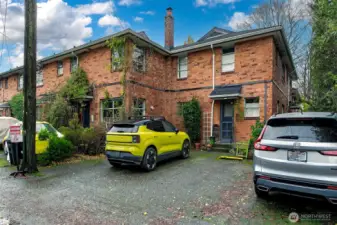 Off street parking - 511 1/2 has the middle space on the south side of the parking area.