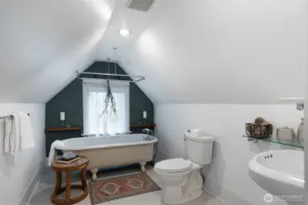 Upstairs bathroom faces west creating the picture perfect backdrop of summer sunsets.