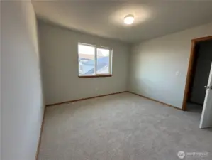 One of two additional bedrooms 10x12 with walk in closet