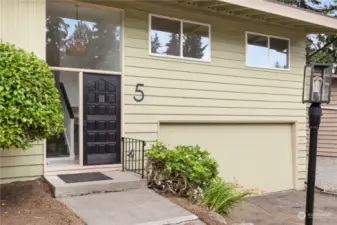 Classic PNW split level design with very large garage.