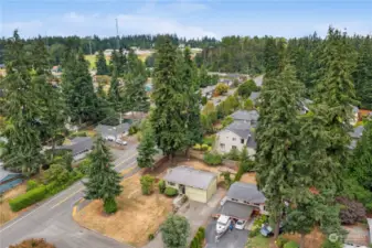 Oversized corner lot. Note additional parking on the side of the house. More additional parking in the gravel next to the driveway.