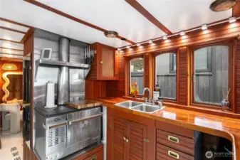 Elegant Wood Kitchenette With Stainless Stove