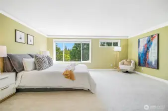 The primary bedroom is oversized with space for a sitting area.