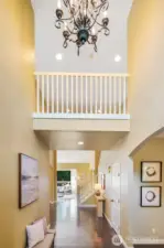 Soaring entry with gleaming floors that flow throughout the main living areas.