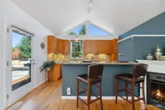 Kitchen with breakfast bar. Door on the left allows access to entertainment sized deck.
