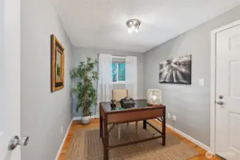 2 of 3 guest bedrooms. Door on the right provides access to garage.