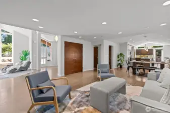 Looking back, you can see the front door entry, the closet for extra storage, the entry to the laundry room and powder room, and door to the garage and loft.