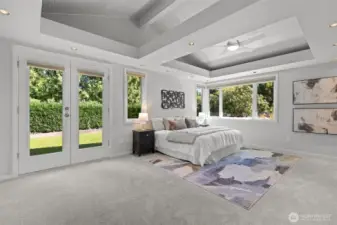 Massive primary suite includes huge bathroom, walk in closet, custom black-out honeycomb blinds, ceiling fan, and private French doors to your side yard.