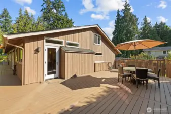 This wrap around Trex deck is party central. Outdoor furniture conveys with the sale of the home.