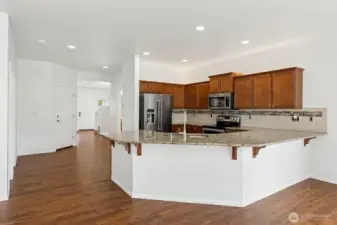 Open kitchen with huge bar island seating.