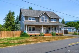 Lovely curb appeal with everyone's favorite- a covered front porch!