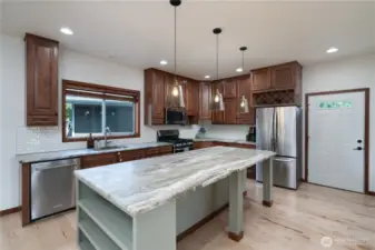 Beautiful kitchen with Cherry cabinets and granite counters, massive breakfast bar island!