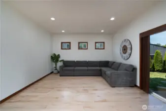 Large living room off kitchen and backyard slider. 9ft ceilings throughout the main floor and recessed lighting.
