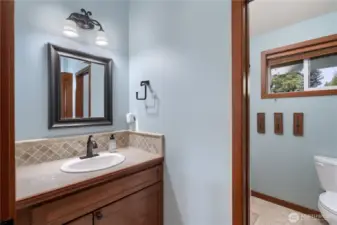 Upper level full bath, freshly painted. Tile vanity and floors.