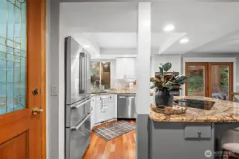 Coming inside, you are in the heart of the home, closet to the kitchen with stainless steel appliances and a window right above the sink that looks out to the yard. There is also a large pantry here off the entry that provides excellent storage.