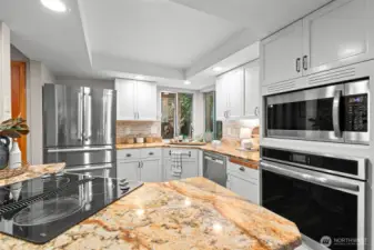 This kitchen is cozy, updated, and the open floorplan around the island makes it the center of the action.