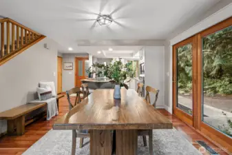 The dining area features French doors out to the wrap around stamped concrete patio.