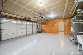 Finished garage, new water heater, vacuum system and pull-down attic storage