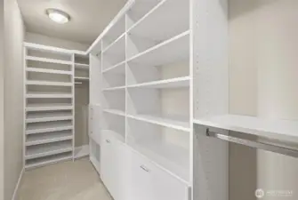 Primary walk-in closet with built-ins.