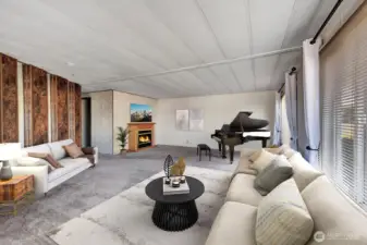 Formal living room is open and bright. Room for sofa, tables, chairs and more. Electric fireplace brings a calming ambiance to the room. Plenty of natural lighting all day from the large vinyl windows that all have privacy blinds for your convenience. Virtually staged.