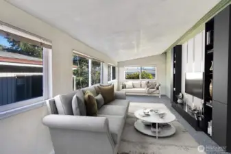 Slider from the kitchen area to this extra finished room. Make it a family room, office, exercise room. You decide.  Custom blinds give you privacy on all vinyl windows. Virtually staged .