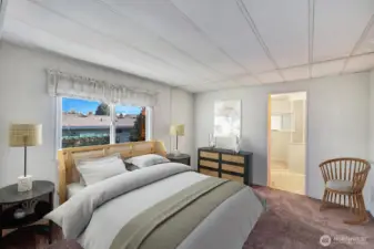 Primary bedroom at the back of the home. Room will accommodate bed and additional furniture. Double door closet with shelves for all of his or her shoes, clothes etc. Virtually staged