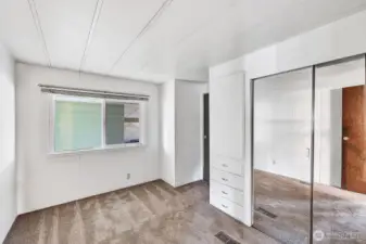 Guest Bedroom with closet and built ins for your comfort. Access door to the guest bathroom.