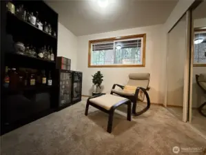 Main floor bedroom used as office/bar.